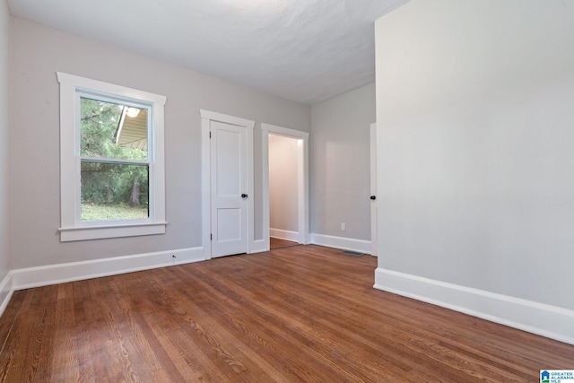 spare room featuring hardwood / wood-style floors