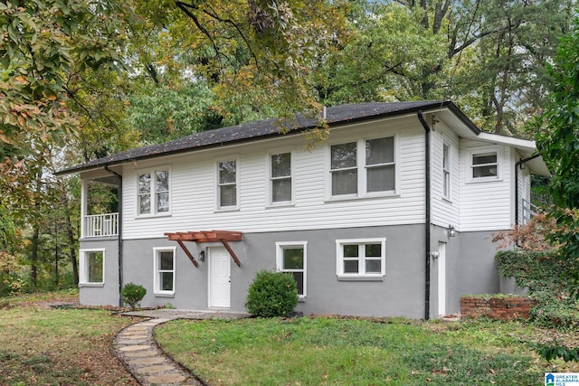 front of property with a front yard and a pergola