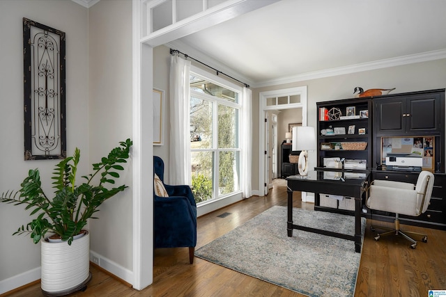 office space featuring hardwood / wood-style floors and ornamental molding