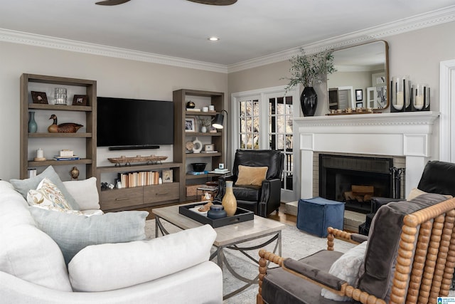 living room with light hardwood / wood-style flooring and crown molding