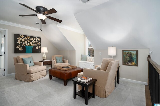 carpeted living room featuring ceiling fan, crown molding, and lofted ceiling