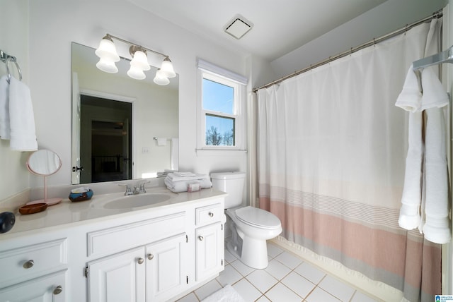 full bathroom with shower / bath combination with curtain, toilet, vanity, and tile patterned flooring