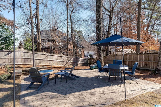 view of patio / terrace featuring an outdoor fire pit