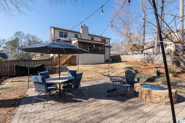 view of patio with an outdoor fire pit