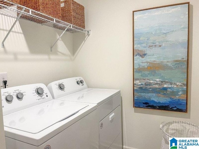 clothes washing area featuring washing machine and dryer