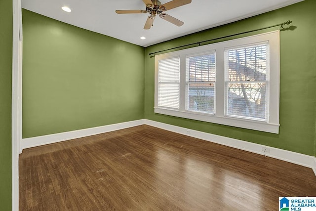 unfurnished room featuring ceiling fan and hardwood / wood-style flooring