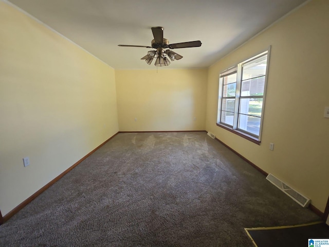 empty room featuring carpet floors and ceiling fan