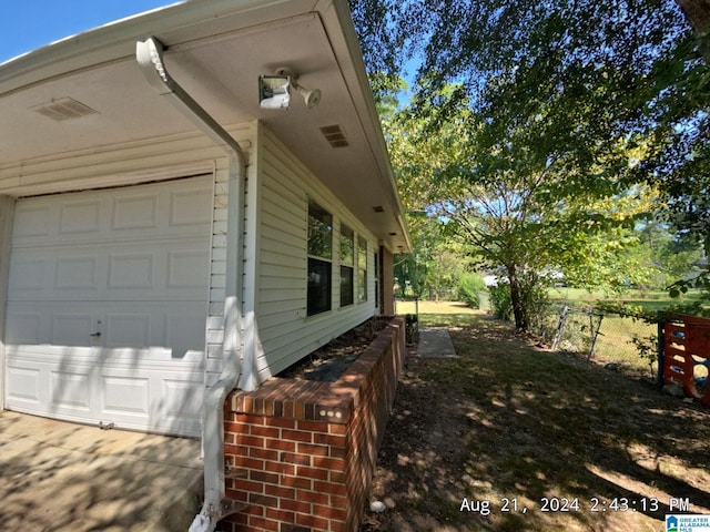 view of property exterior featuring a garage