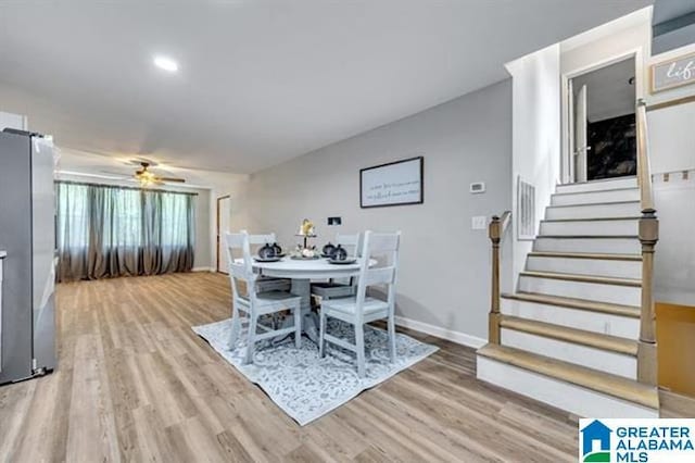 dining room featuring hardwood / wood-style flooring and ceiling fan