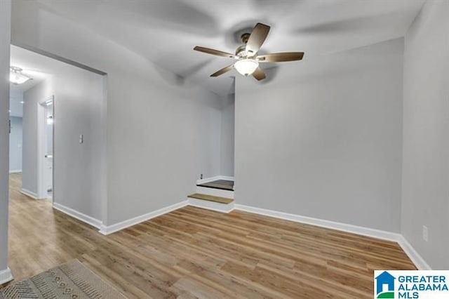 unfurnished room featuring hardwood / wood-style flooring and ceiling fan