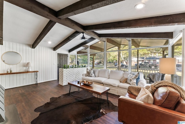 living room featuring vaulted ceiling with beams and dark hardwood / wood-style flooring