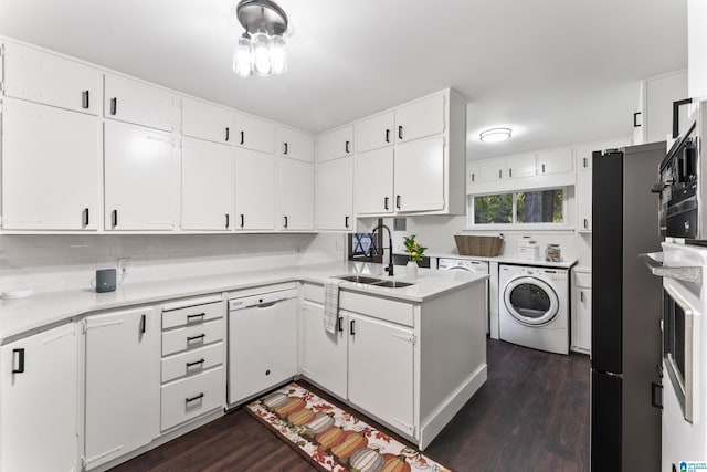 kitchen featuring sink, white cabinets, dishwasher, and washer / clothes dryer