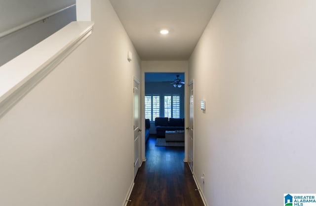 corridor featuring dark hardwood / wood-style flooring