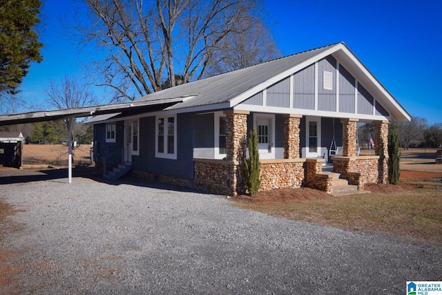 view of front of home with a carport