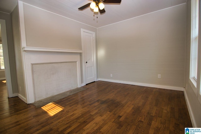 unfurnished living room with ceiling fan and dark wood-type flooring