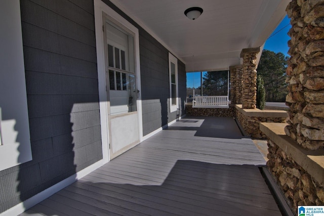 wooden terrace with covered porch