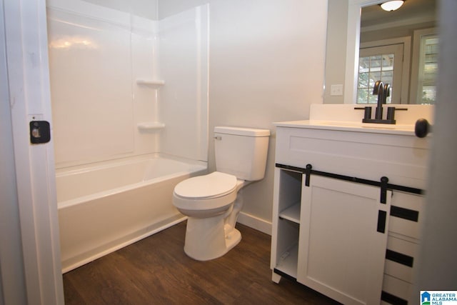 full bathroom with bathtub / shower combination, wood-type flooring, toilet, and vanity