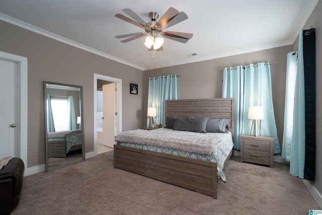 carpeted bedroom featuring ceiling fan and ornamental molding