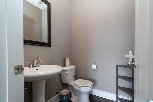 bathroom with sink and toilet