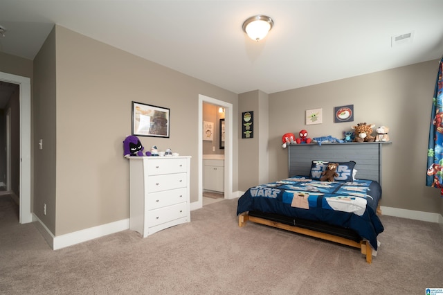 carpeted bedroom with ensuite bathroom