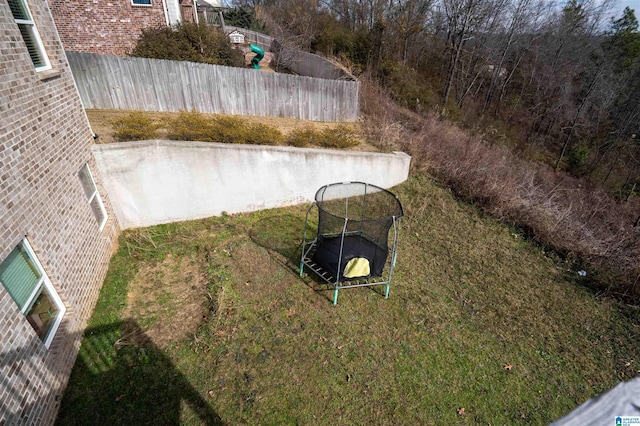 view of yard featuring a trampoline