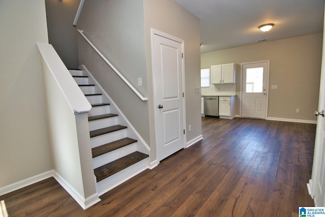 stairway featuring wood-type flooring