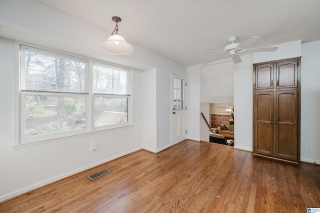 interior space featuring hardwood / wood-style flooring and ceiling fan