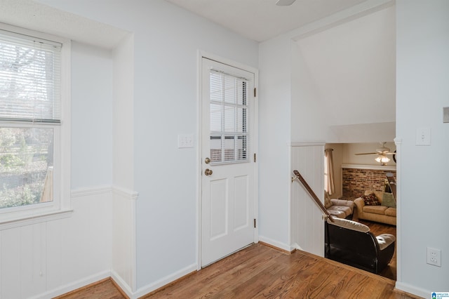 foyer featuring ceiling fan and hardwood / wood-style floors