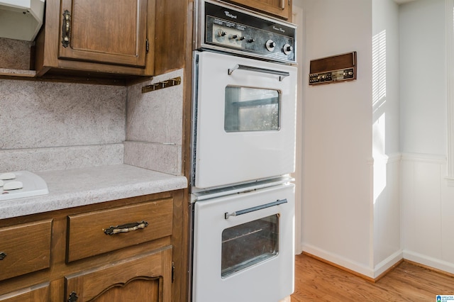 kitchen featuring light hardwood / wood-style flooring and double oven