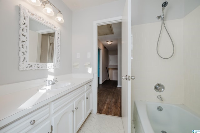 bathroom featuring  shower combination, tile patterned floors, and vanity