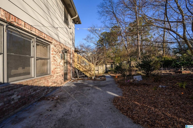 view of property exterior with a patio