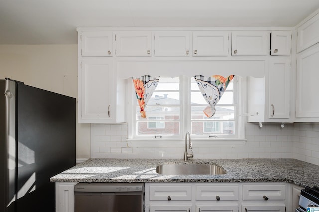 kitchen with white cabinetry, sink, backsplash, and appliances with stainless steel finishes