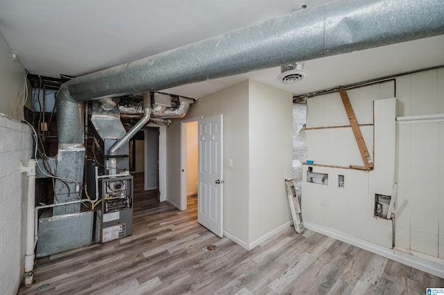 utility room with heating unit