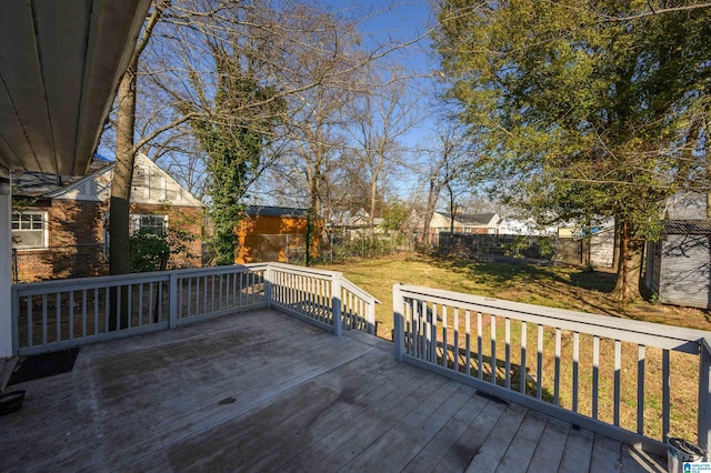 wooden terrace featuring a yard