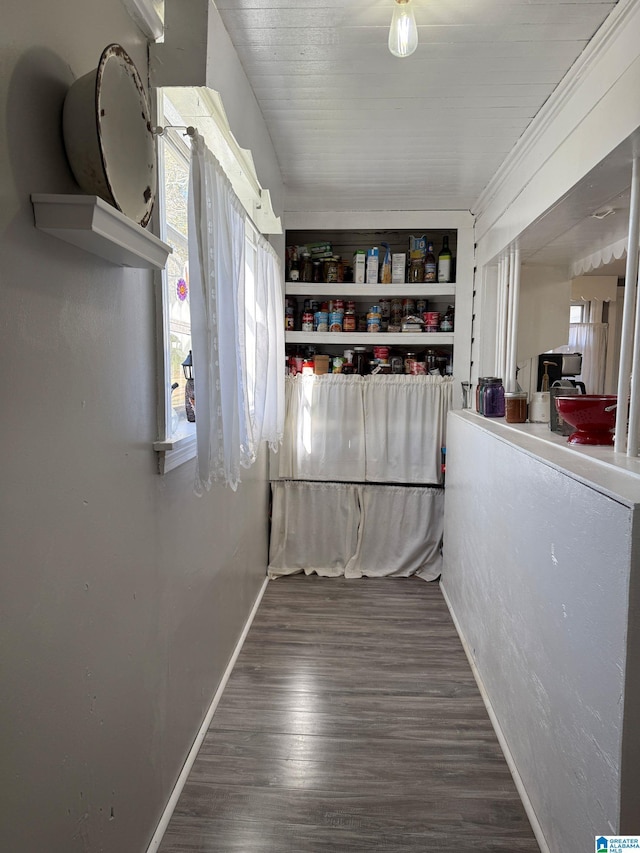 interior space with dark wood-style flooring and baseboards