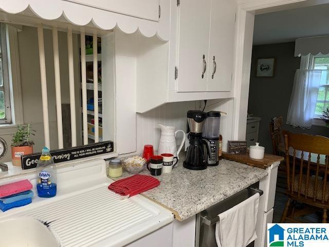 kitchen featuring white cabinetry