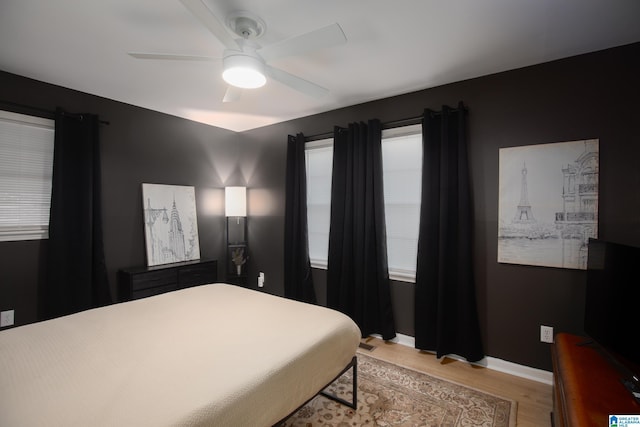 bedroom featuring light hardwood / wood-style flooring and ceiling fan