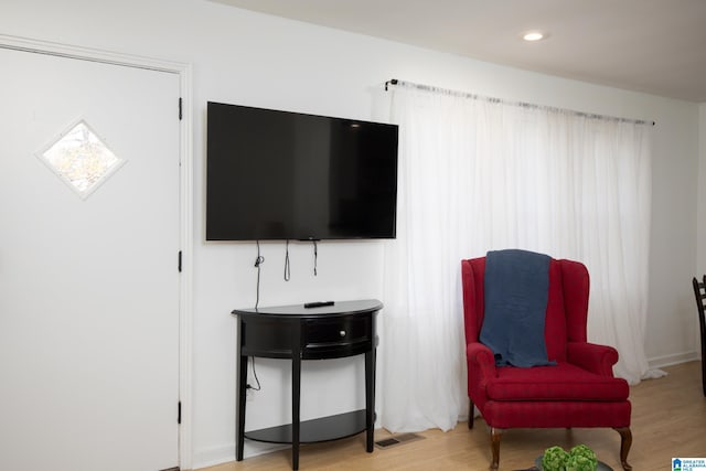 sitting room with light hardwood / wood-style flooring