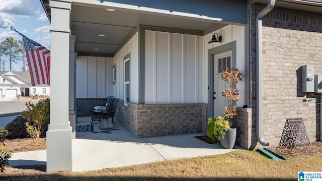 doorway to property featuring a patio area