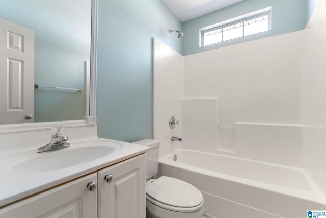 full bathroom featuring toilet, vanity, and shower / washtub combination