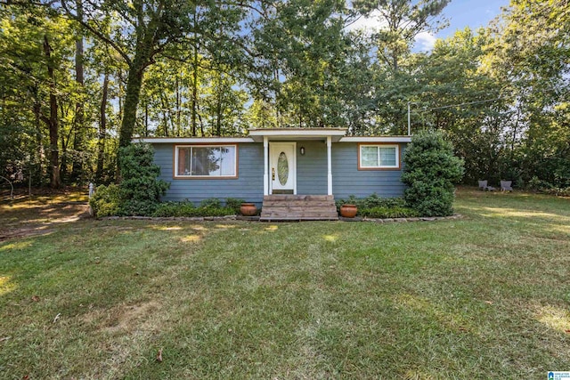 single story home featuring a front yard