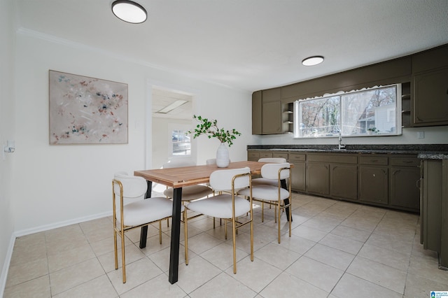 dining area with sink and light tile patterned floors