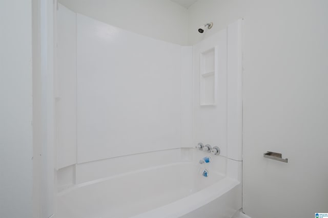 bathroom with bathing tub / shower combination