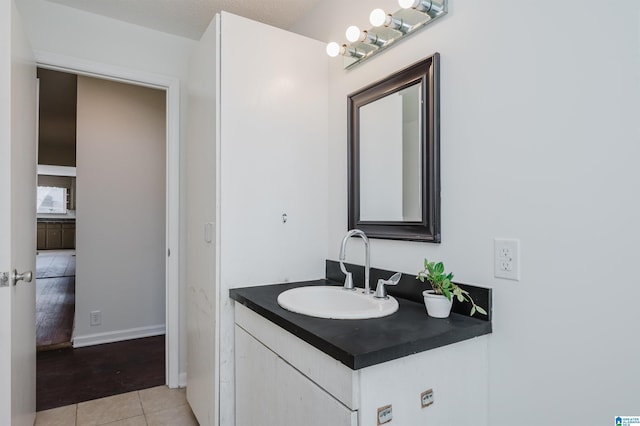 bathroom featuring vanity and tile patterned flooring