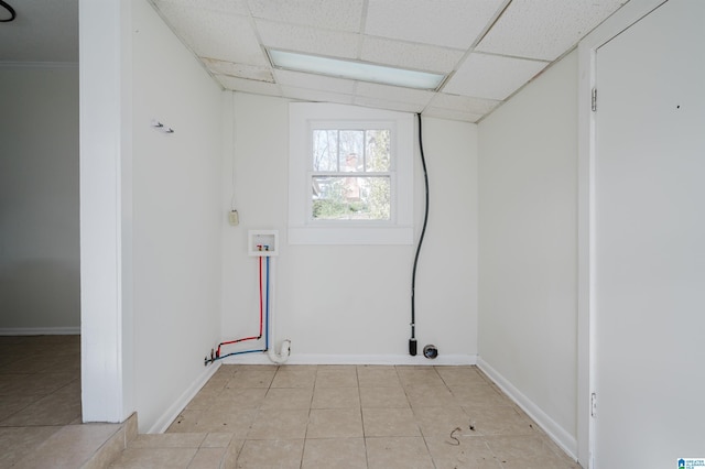 washroom featuring light tile patterned flooring and hookup for a washing machine