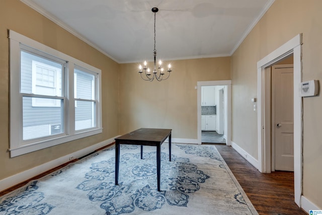 interior space with ornamental molding, dark hardwood / wood-style floors, and a chandelier