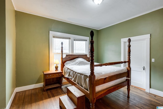 bedroom with crown molding and wood-type flooring