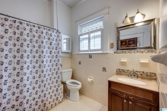 bathroom featuring tile walls, vanity, walk in shower, toilet, and tile patterned floors