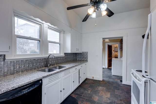 kitchen featuring sink, white appliances, tasteful backsplash, white cabinets, and washer / dryer