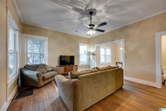 living room with crown molding, hardwood / wood-style floors, and ceiling fan